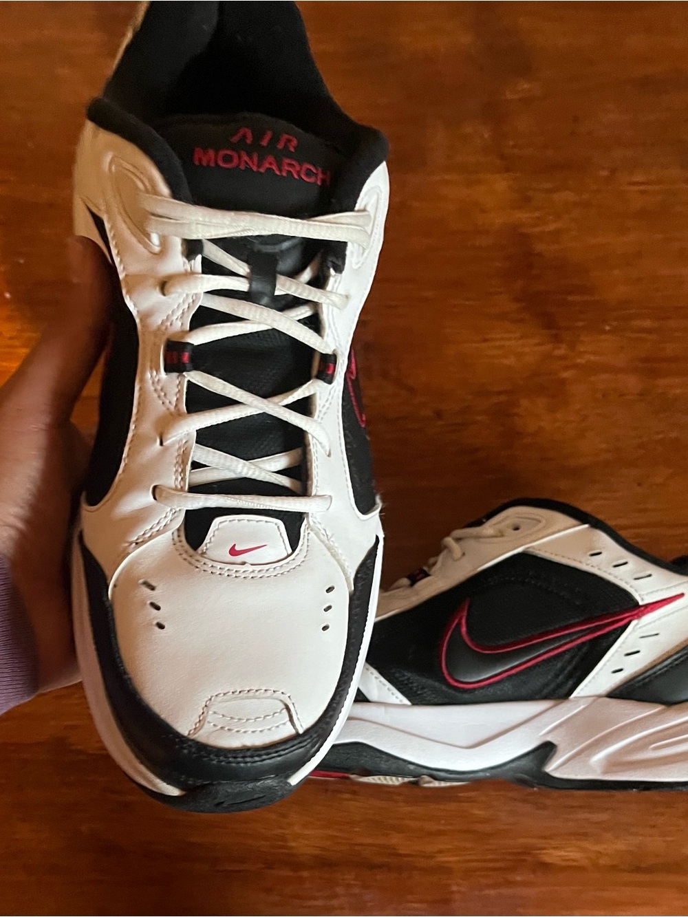 Nike Air Monarch IV shoes in a white, black, and red colorway Men’s Size 12